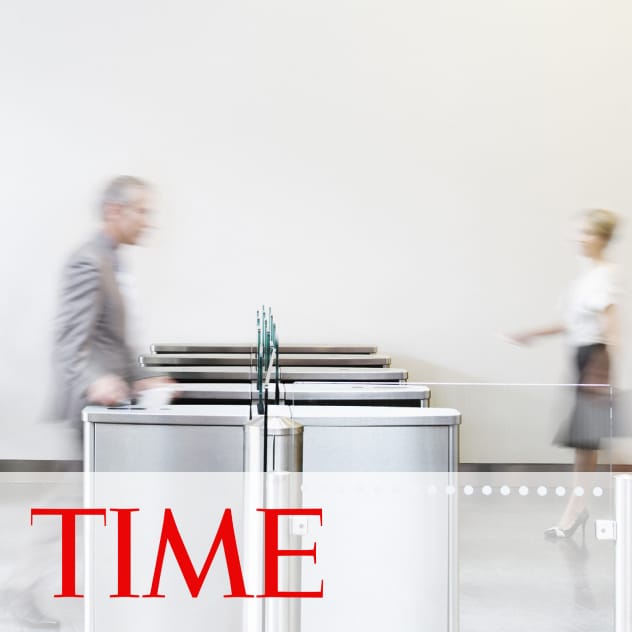 Time news article of men and women walking through a security checkpoint in a office building.